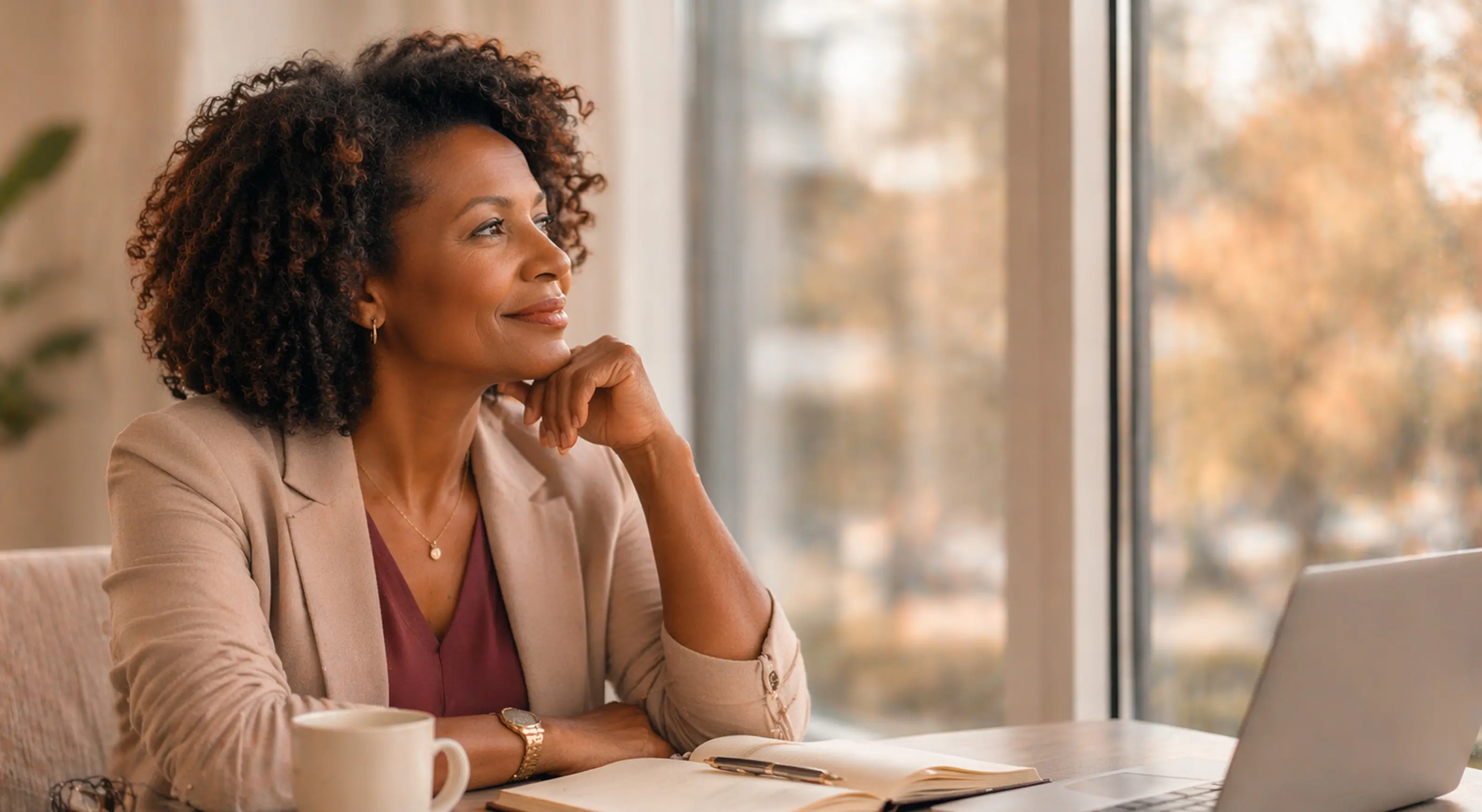 Confident woman in her 40s reflecting and planning her next career step
